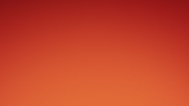 A close-up of three red lipsticks with gold packaging against a gradient orange background.