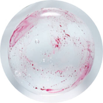 A circular bubble with swirling red and pink patterns suspended in clear liquid, surrounded by tiny air bubbles.