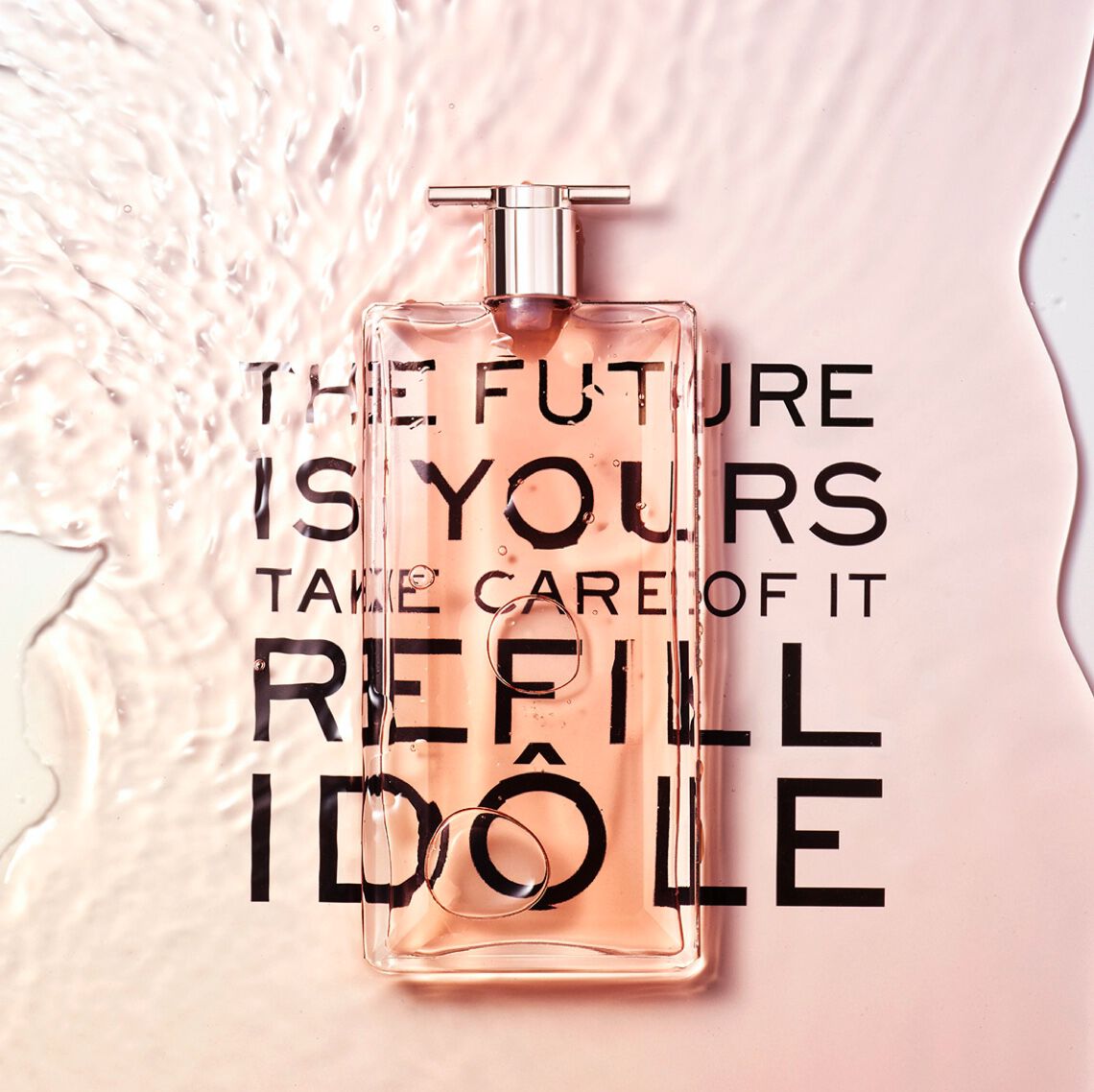 A transparent bottle of perfume sits on a smooth surface, surrounded by a splash of water. The words "THE FUTURE IS YOURS TAKE CARE OF IT REFILL" are printed beneath the bottle in bold, contrasting letters.