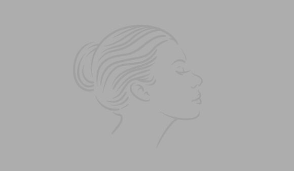 An outline of a woman's profile against a light gray background, featuring smooth lines and an elegant hairstyle.