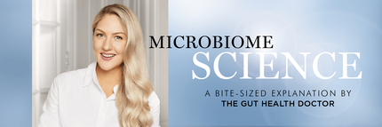 A smiling woman with long, wavy blonde hair is featured alongside the text "Microbiome Science: A Bite-Sized Explanation by The Gut Health Doctor." The background is light and soft, creating a clean, professional look.