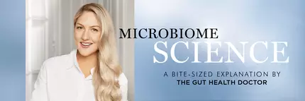A smiling woman with long, wavy blonde hair is featured alongside the text "Microbiome Science: A Bite-Sized Explanation by The Gut Health Doctor." The background is light and soft, creating a clean, professional look.