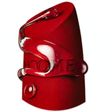A red lipstick tube with a glossy, swirled design, showcasing elegance and sophistication, against a plain background.