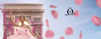 A dancer in a pink tulle dress poses gracefully in front of the Arc de Triomphe, surrounded by floating pink petals. A logo is featured on the right side.