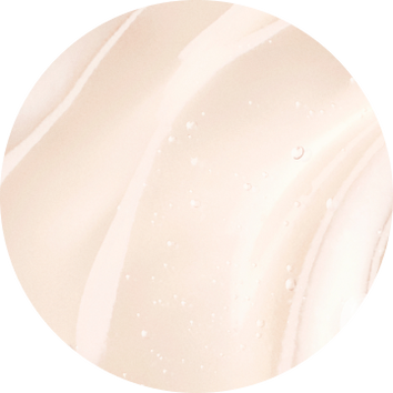 Close-up of soft, creamy beige marbled texture with subtle highlights and droplets, creating an elegant and smooth appearance.
