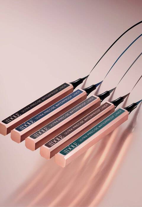 Five sleek, metallic-tipped ultra-precision waterproof markers arranged in a row against a soft gradient background, showcasing their elegant design and functionality.
