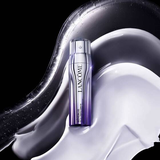 A product shot of Lancome’s Renergie H.C.F. Triple Serum on an imposed serum-like background.