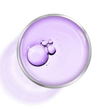 A close-up of a silver circle containing purple liquid with shimmering bubbles, set against a white background.