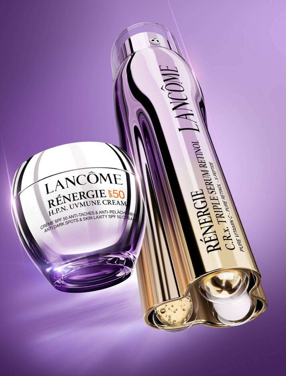 A glossy purple background featuring two Lancome skincare products: a jar of Renegie H.P.N. Triple Serum and a bottle of Renegie C.R. Triple Serum, both showcasing their elegant design and branding.