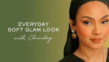 A woman with a dark headscarf, warm-toned makeup, and statement earrings looks directly at the viewer. To her left, text on a green background reads "EVERYDAY SOFT GLAM LOOK with Chinutay."