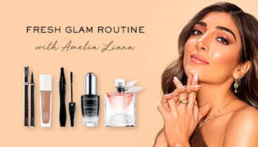 Amelia Liana is pictured with Lancome makeup and perfume products on a peach background, alongside the text "FRESH GLAM ROUTINE with Amelia Liana".